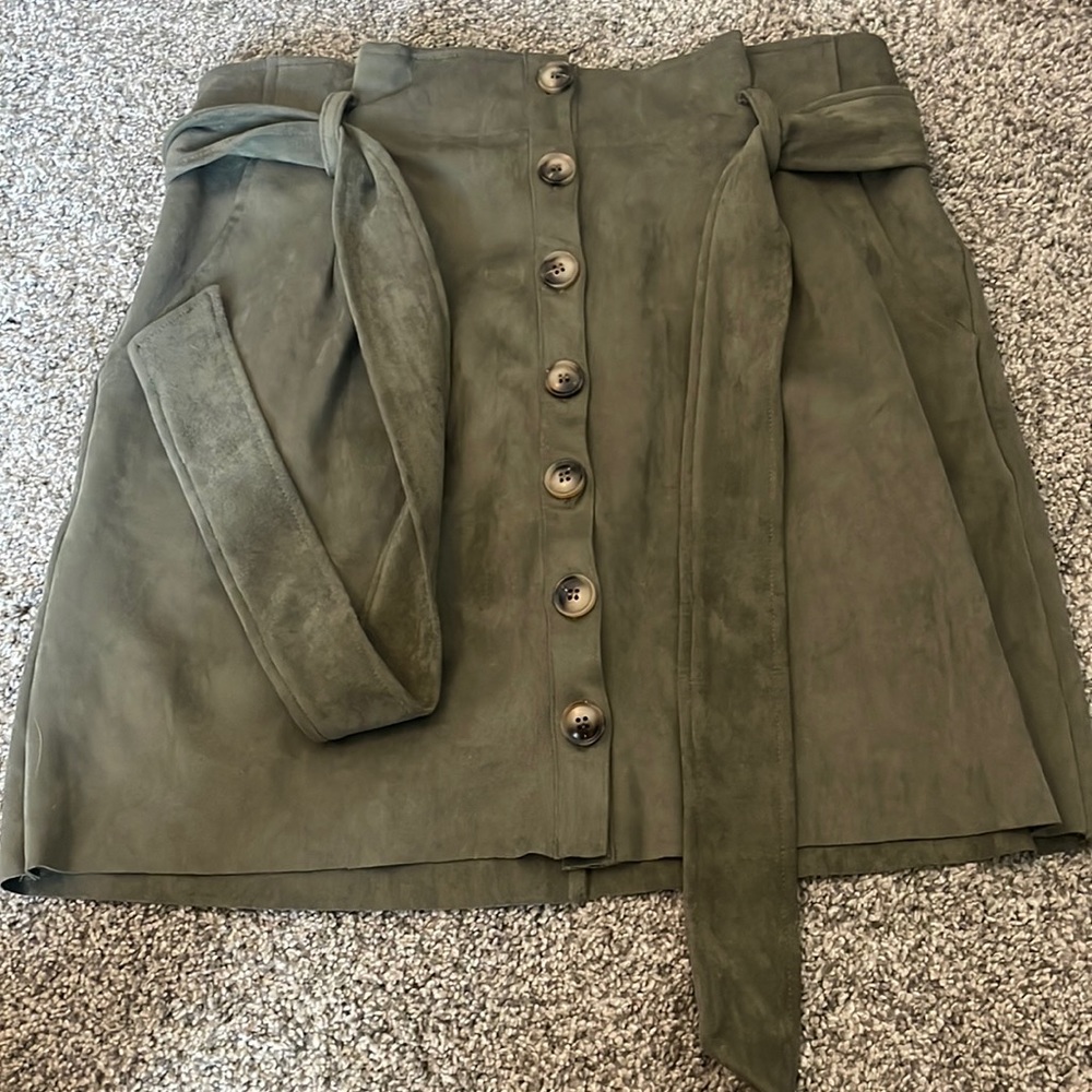 Brand new with tags suede skirt with buttons and belt.